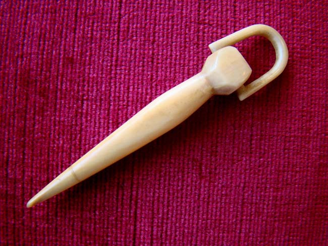 A fine 19th century sailor-made whale ivovy bodkin with handle loop